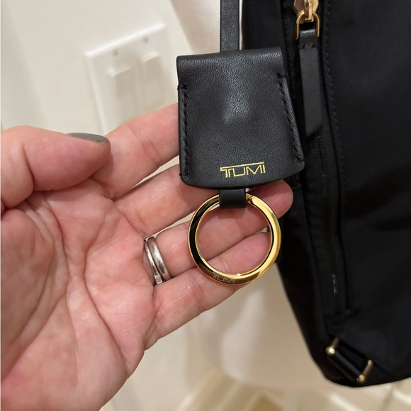 TUMI crossbody sling travel bag Great condition Black gold trim no odors/ tears - Picture 4 of 13